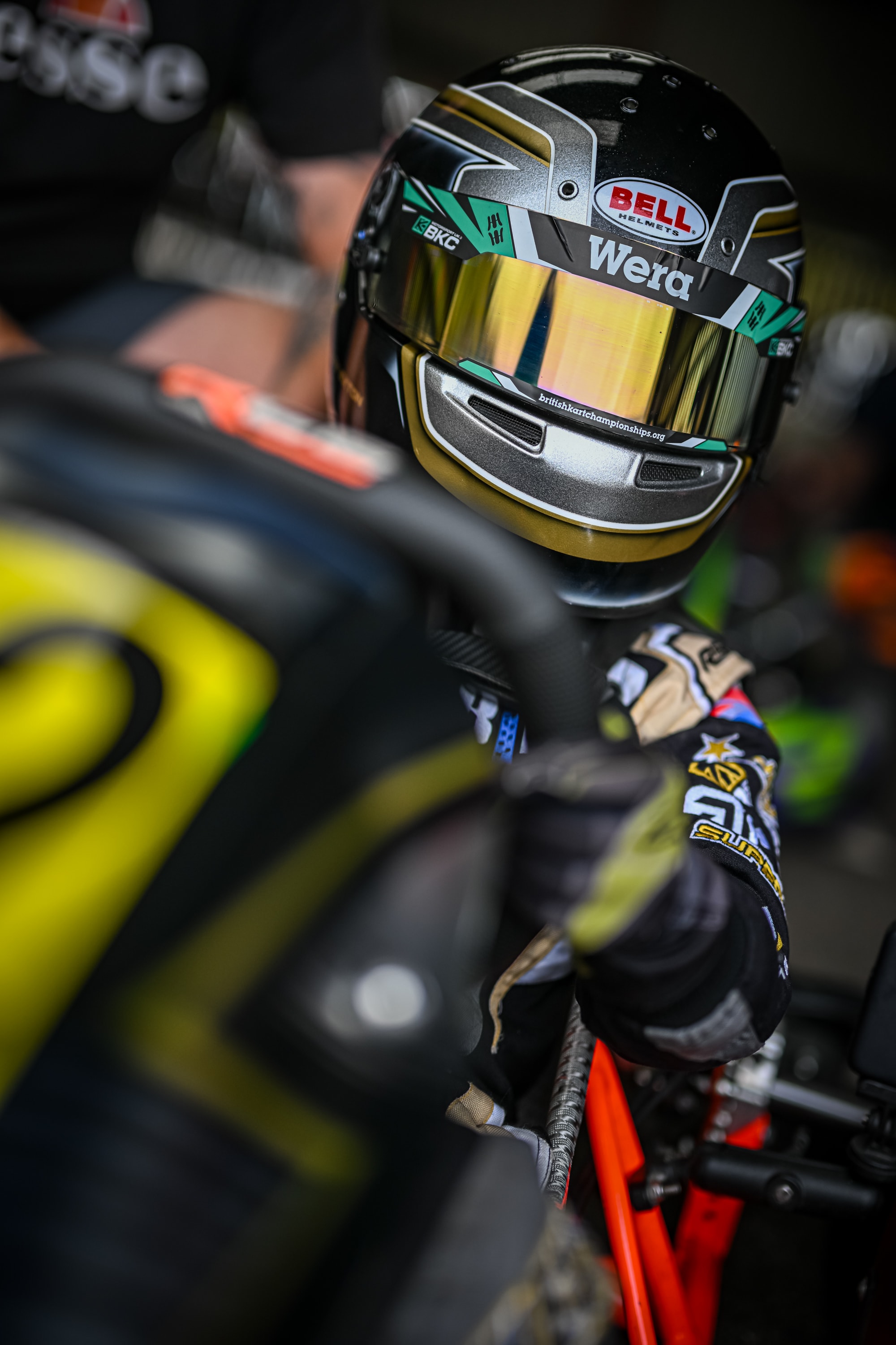 Henry Exton Bell Wera helmet close-up in paddock garage at Rowrah