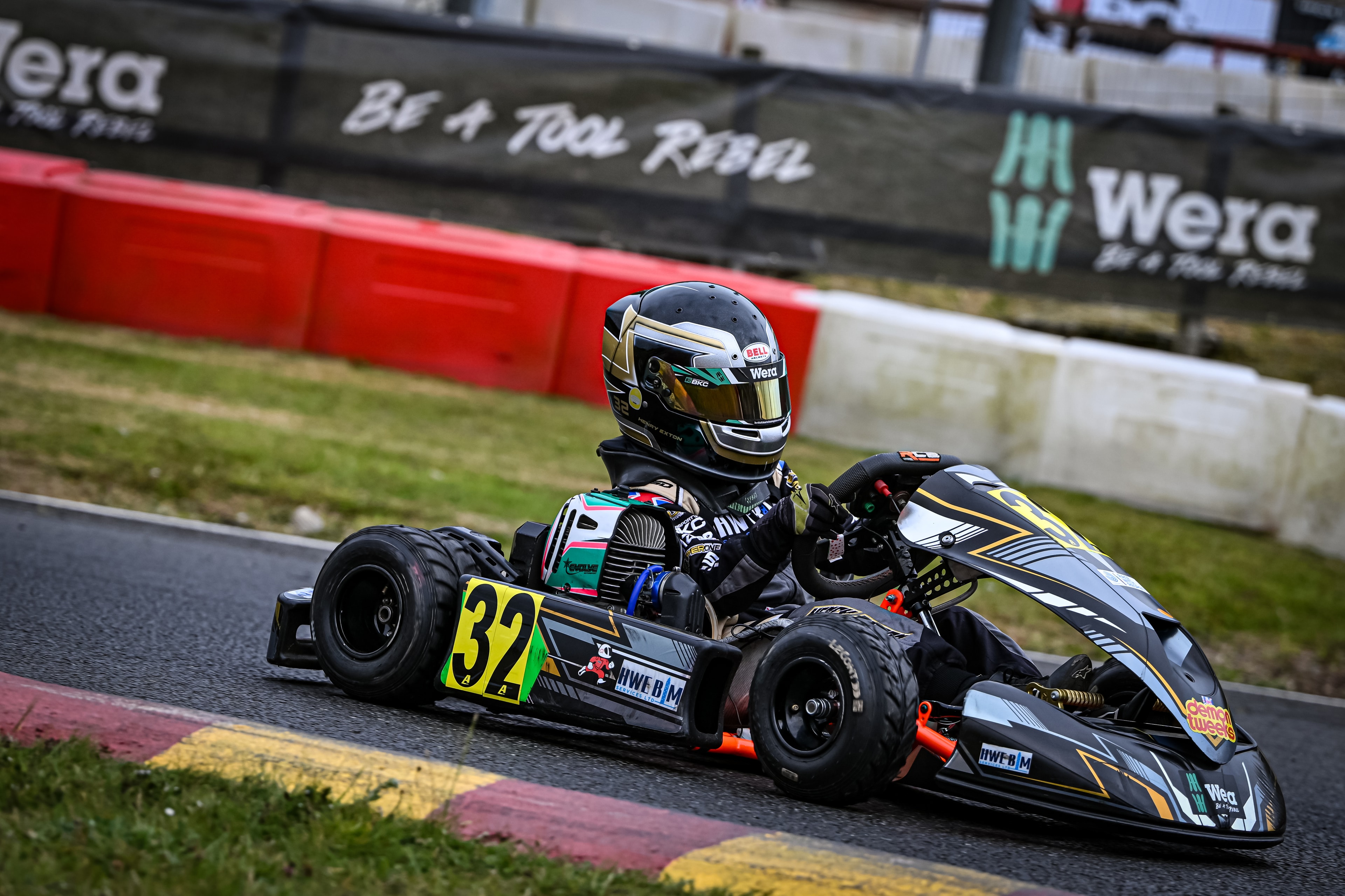 Henry Exton kart number 32 cornering at Rowrah with Wera branding on barriers