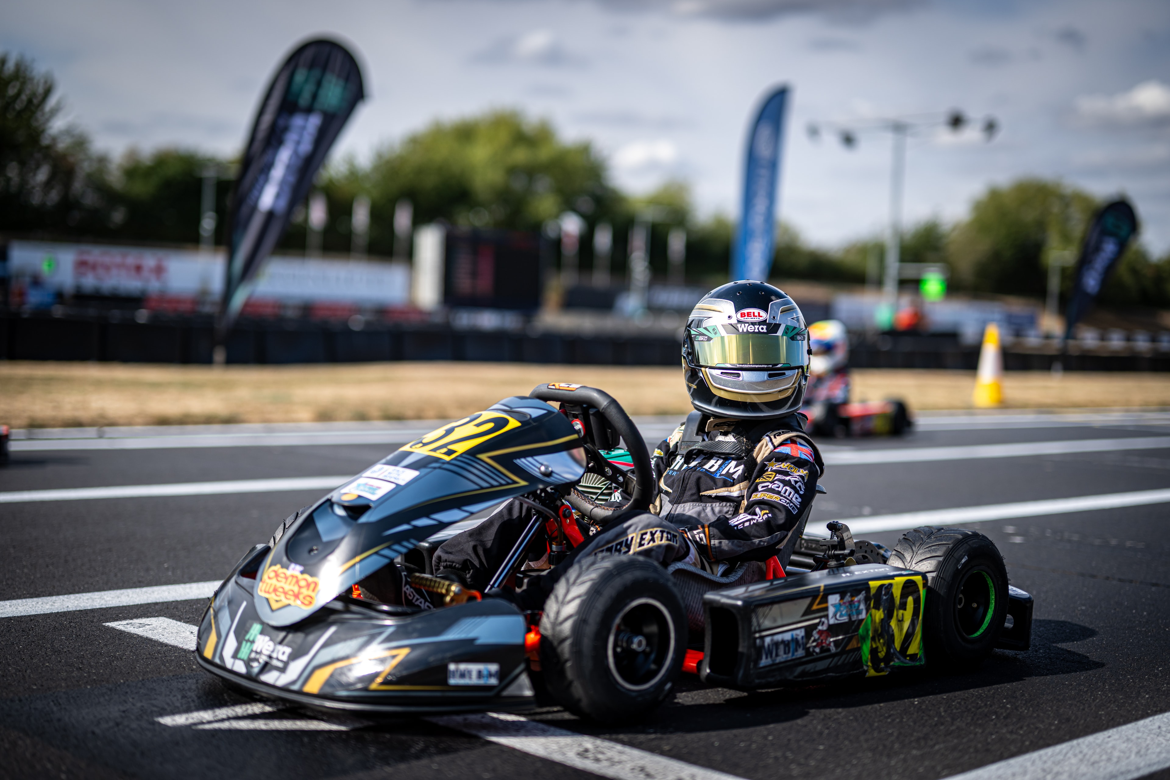 Henry Exton kart number 32 solo on track at PFI in bright conditions