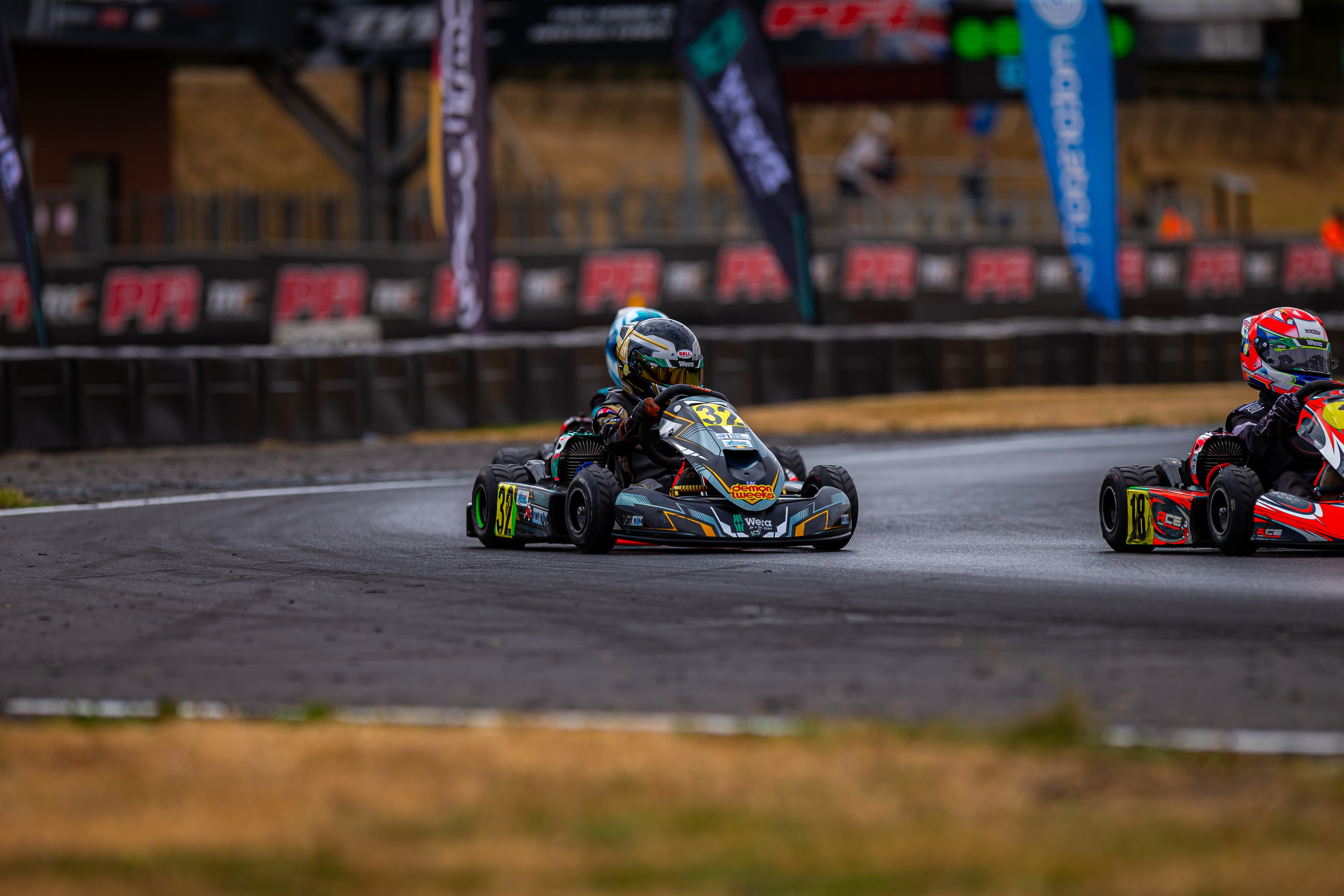 Henry Exton kart number 32 in wet conditions at PFI