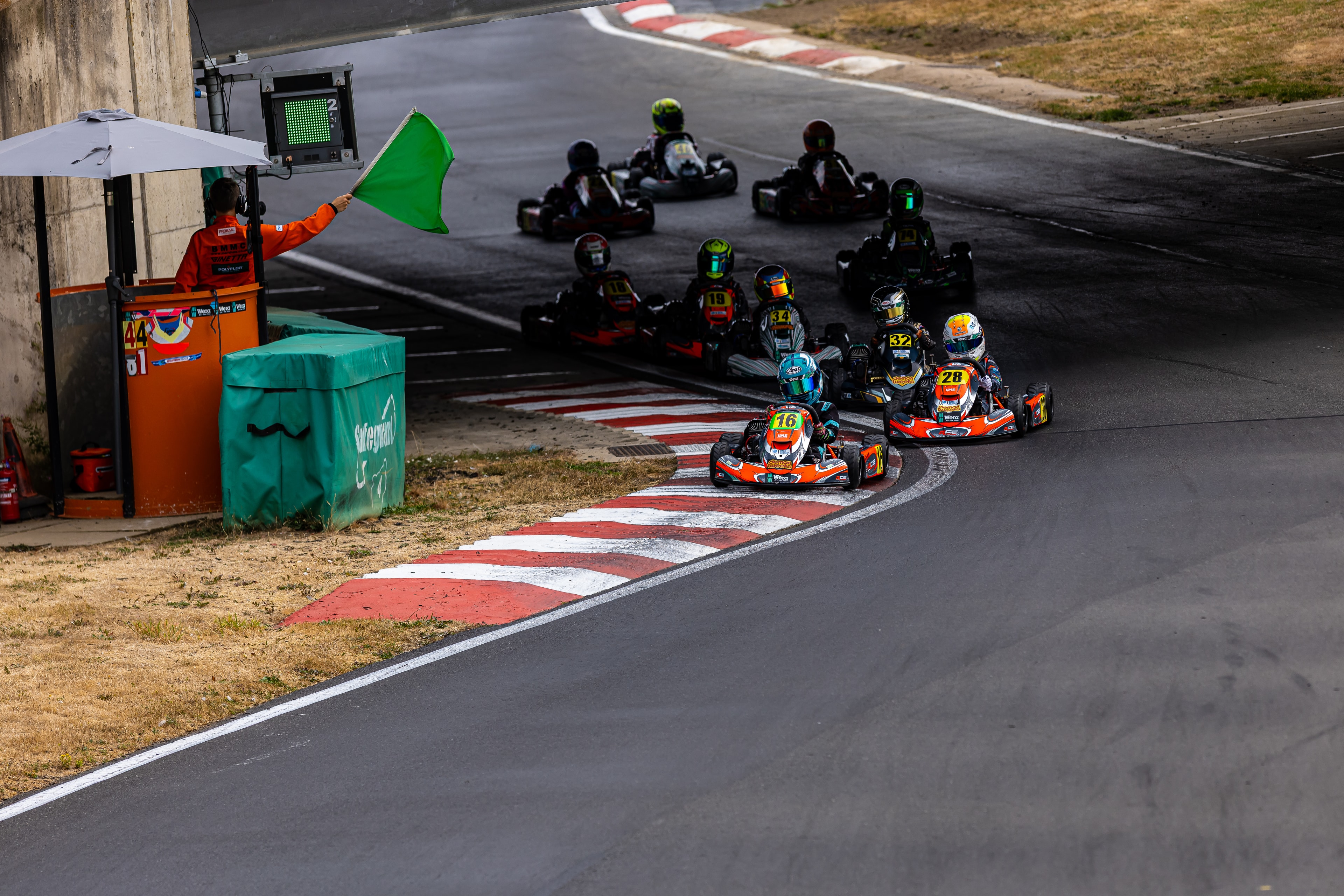 Green flag start at PFI with Henry Exton kart number 32 in the pack