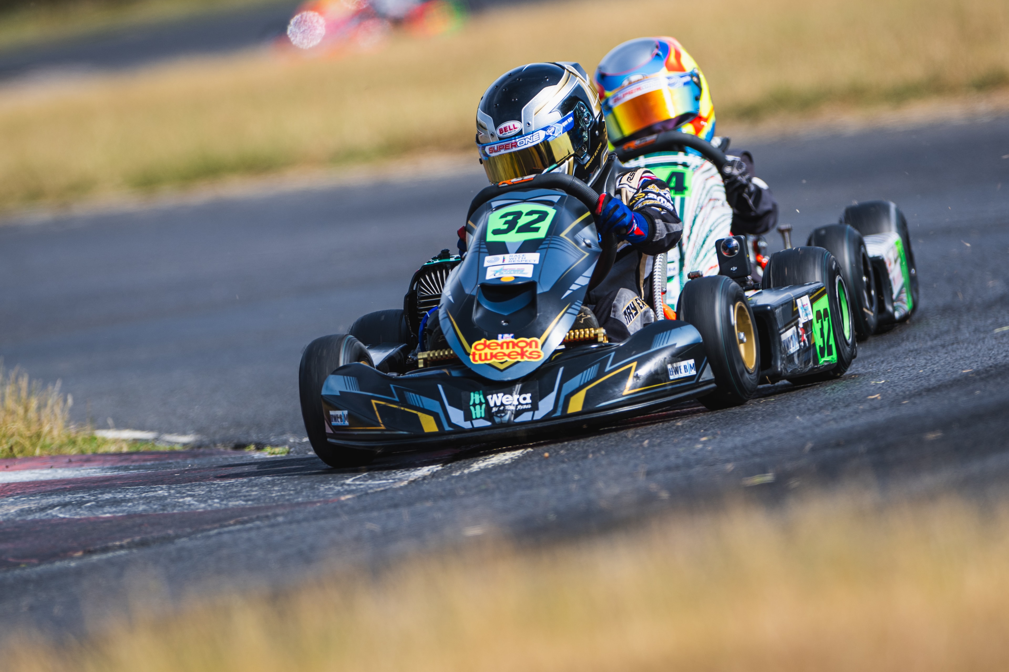 Henry Exton kart number 32 in close battle at Whilton Mill
